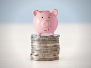 Image of piggy bank on a stack of coins